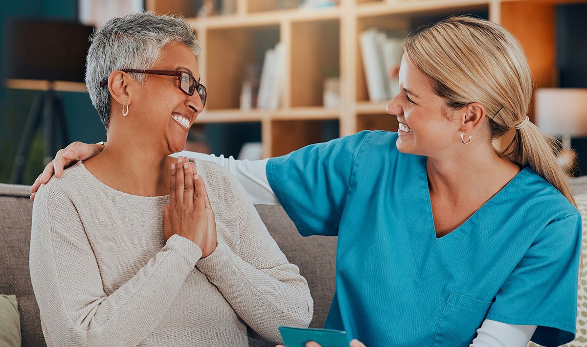 hospice care facility advertising and marketing senior care nurse talking with elderly patient