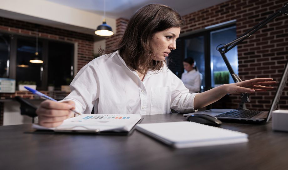 Woman developing Logo on Laptop