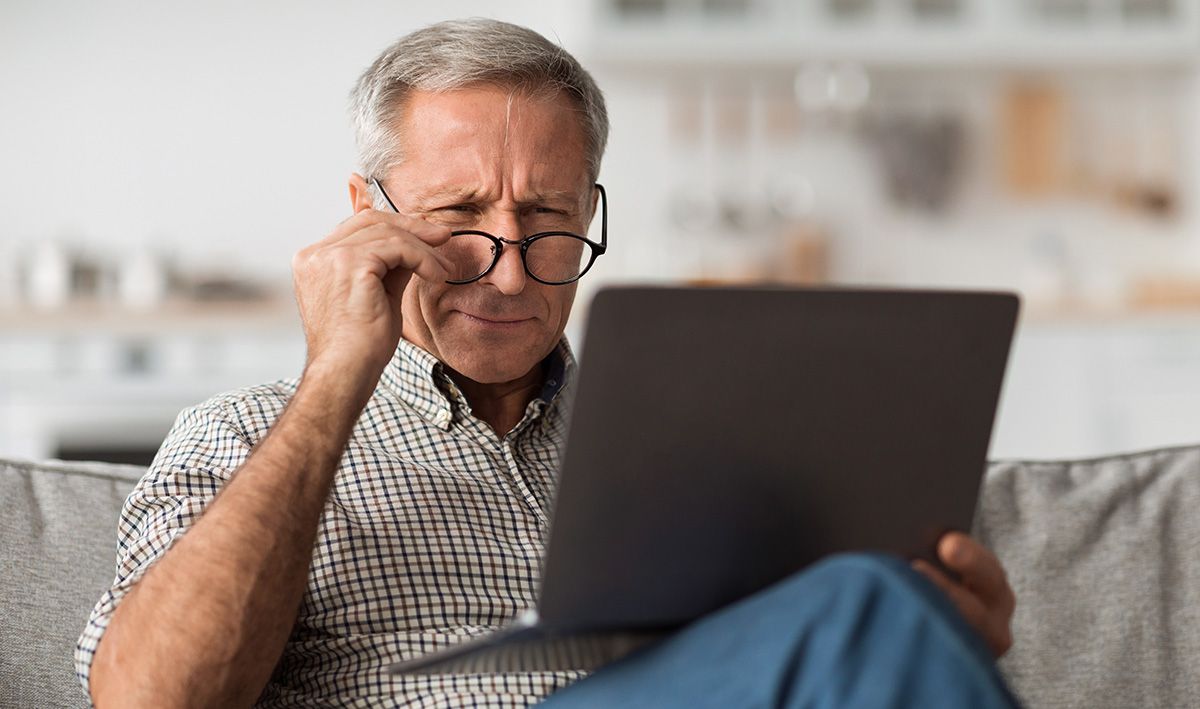 older man on healthcare website in need of web accessibility tool